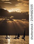 Racing sailboats at the seafront of Thessaloniki, Greece at sunset