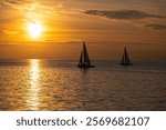 Racing sailboats at the seafront of Thessaloniki, Greece at sunset