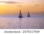 Racing sailboats at the seafront of Thessaloniki, Greece at sunset