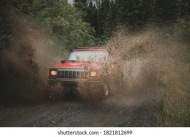 Racing through muddy puddles with an SUV