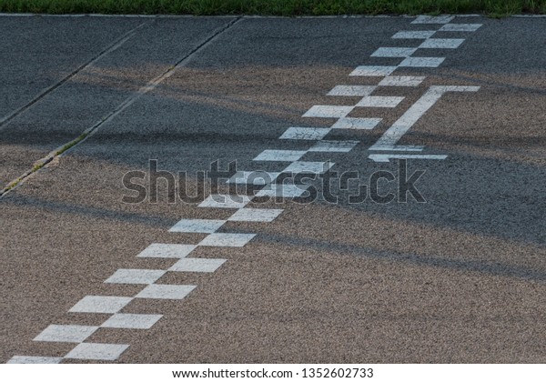 Racing track\
finish line. Signs on a finish\
line.