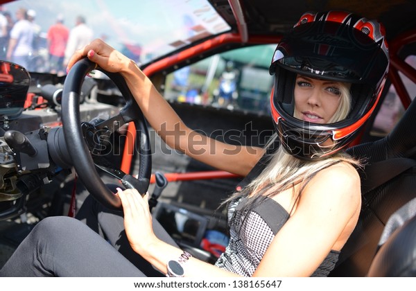 racing woman in sport\
car