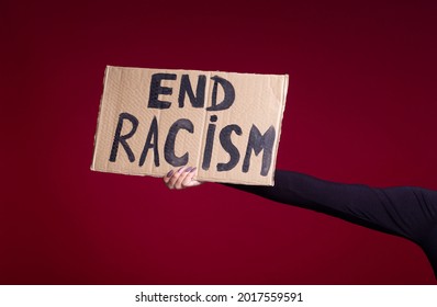 Racism concept. Cardboard banner. Stop Racism message
