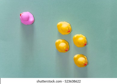 Racism, Discrimination And Social Exclusion Concept With Color Rubber Ducks