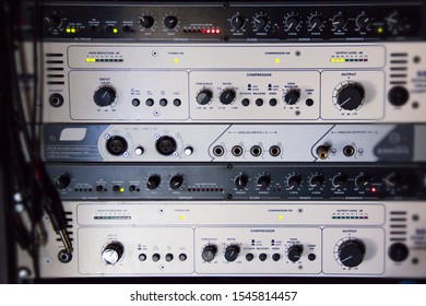 A Rack Of Audio Compressors And Other Components Of Sound Reinforcement System In A Recording Studio Close Up. Making Music In The Professional Studio
