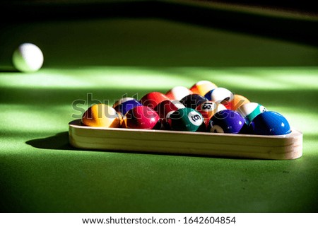 rack of balls on pool table
