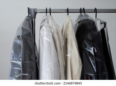 Rack With Clean Coats After Dry Cleaning On A Dry Cleaner. Quality Laundry Service. Hangers Row. Winter Season.