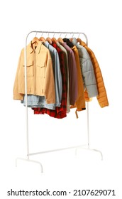 Rack with different jackets on white background