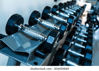 Rack with dumbbells of different weights. Samui , Tailand - 02.08.2020