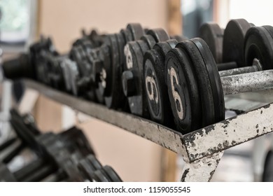 Rack With Dumbbells In The Old Gym