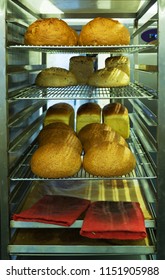 Rack of fresh bread cooling down.