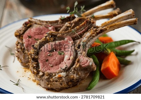 Rack of Lamb : Elegantly herb-crusted lamb rack roasted to a perfect blushing pink, plated with crisp green beans and glazed carrots for a fine dining restaurant-quality special occasion feast