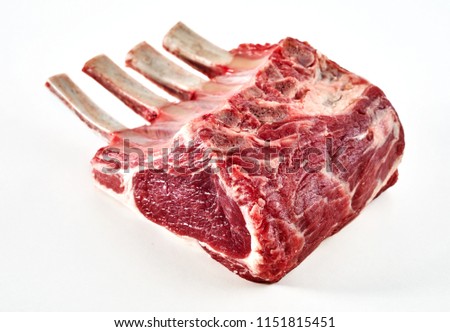 Rack of lamb trimmed with bone-in ready for cooking isolated on white with copy space