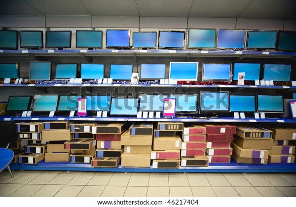 Rack with liquid crystal displays and monitors in\
electronics shop