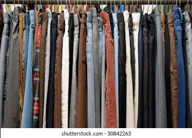 A Rack Of Mens Pants In A Second Hand Shop