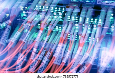 Rack Mounted Servers In A Server Room, Server Rack Audio Cable. Severs Computer In A Rack At The Large Data Center. Fiber Optical Connector Interface For Telecommunications.  