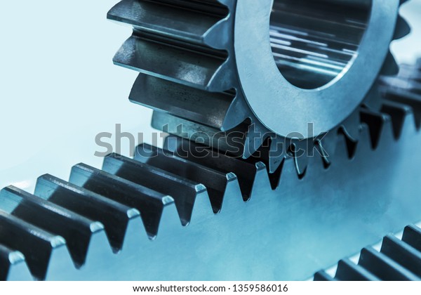 Rack with pinion gear. Toothed rack and\
pinion gear, metal cog tooth wheel and\
rack