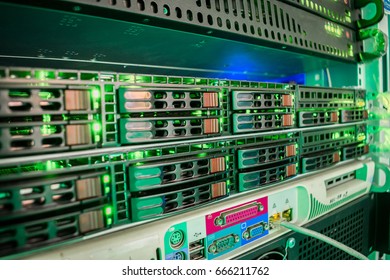 A rack with powerful data processing servers installed in the data center server room. Front panel of powerful computers. Interfaces between the device and the user