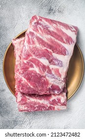 Rack Of Raw Pork Spare Ribs. White Background. Top View