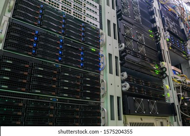 Racks with powerful servers are in the data center. The computer equipment of the Internet provider is in the server room. Hosting platform of a modern technology company. View from the bottom