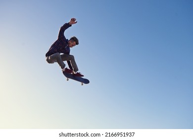 A rad day at the skate park. A young man doing tricks on his skateboard at the skate park. - Powered by Shutterstock