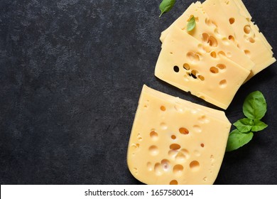 Radamer Cheese On A Black Concrete Background. View From Above.