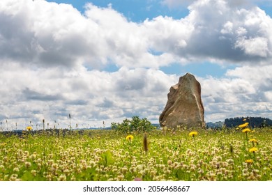 Radek Jaros Monument - a large stone erected in a green meadow in the saddle between the Dratnik rock and the village of Samotin, Czech republic, - Shutterstock ID 2056468667