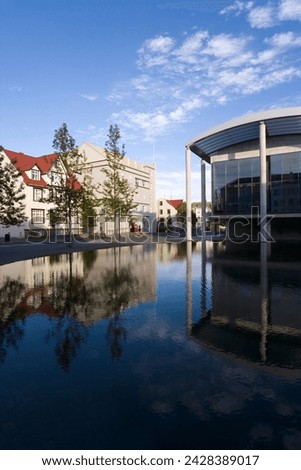 The radhus (city hall), an angular construction of concrete, glass and carved lava, lake tjorn, central area, reykjavik, iceland, polar regions