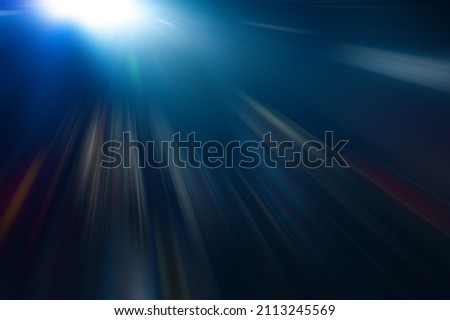 Radial white, blue rays on a dark, abstract background. Background for design.