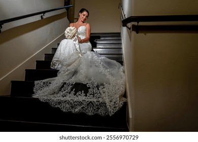 A radiant bride stands elegantly in her exquisite wedding dress, intricate lace cascading delicately, shimmering in soft light, her joyful eyes reflecting excitement for the love-filled journey ahead. - Powered by Shutterstock