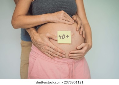 Radiant and confident, a woman in her 40s embraces pregnancy, defying age stereotypes and celebrating the beauty of motherhood - Shutterstock ID 2373801121