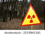 Radiation warning sign in the Exclusion Zone of the Chernobyl power plant (Pripyat, Ukraine).