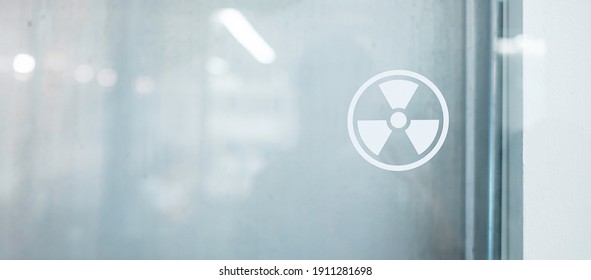 Radiation Zone Sign Sticker On Window Of Laboratory Room. Health And Safety Concept