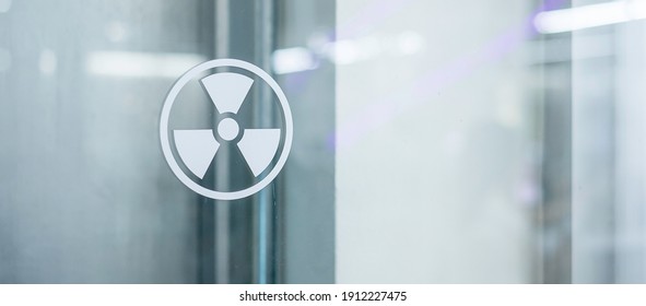 Radiation Zone Sign Sticker On Window Of Laboratory Room. Health And Safety Concept