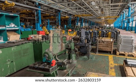 Radiator assembling on tractor timelapse while conducting tune up, maintenance on the tractor. Tractor industrial factory