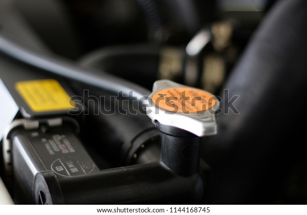 Radiator cap and car tag, message and safety symbol\
in the car engine.Symbols, warning signs, forbidden signs,\
icons