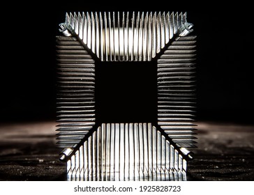 The radiator of the cooling system of the computer processor in the backlight. Aluminum radiator in dark colors. 