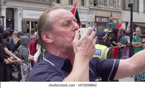 Radical Left Wing Antifa Member Screams Into A Microphone In Central London, UK, 03/08/19