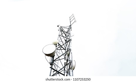Radio antenna tower telecommunication against cloudy sky in low angle view. Isolated on white background. - Shutterstock ID 1107253250