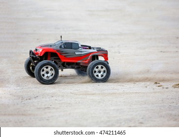 Radio Controlled Car Model In Race Quickly Moving On The Sandy Road 