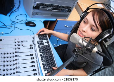 A Radio DJ Announces News In A Studio