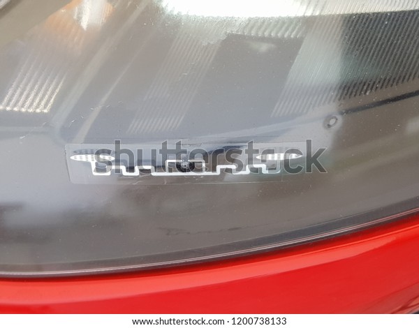  radio frequency identification sticker tag placed\
on a headlamp or a car 
