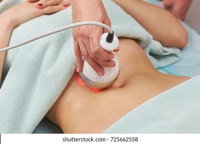 Radio frequency skin tightening, belly. Female body, cosmetology procedure.
