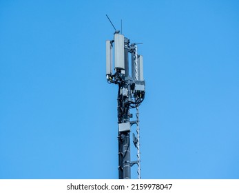 Radio mast on blue background Electrosmog