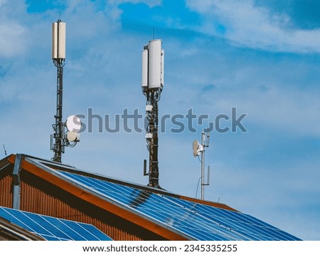 Radio masts on large roof with solar system