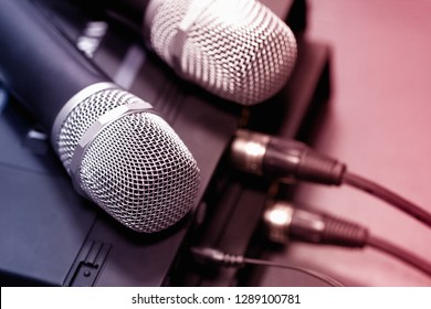 Radio Microphones. Wireless Sound Transmission System. Microphones Are On The Receiver. Audio Wires Are Connected. Soft Focus Two Mic