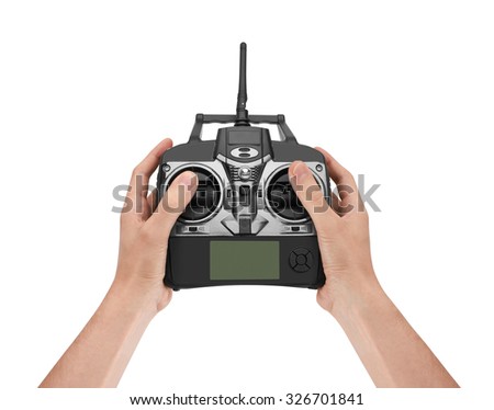 Radio remote control in hand, isolated on white background