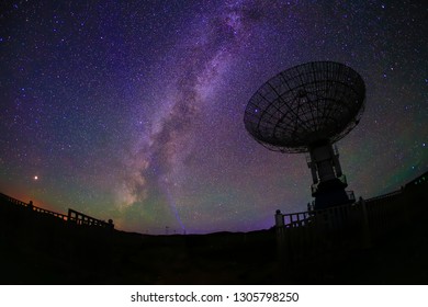 Radio telescopes and the Milky Way at night - Shutterstock ID 1305798250