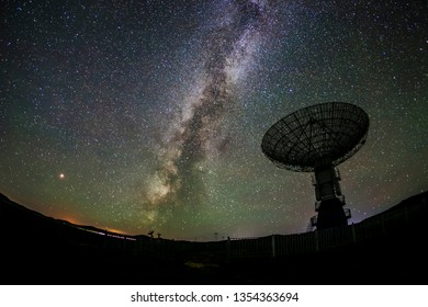 Radio telescopes and the Milky Way at night - Shutterstock ID 1354363694