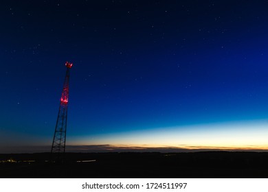 Radio Tower At Night Sky With Stars